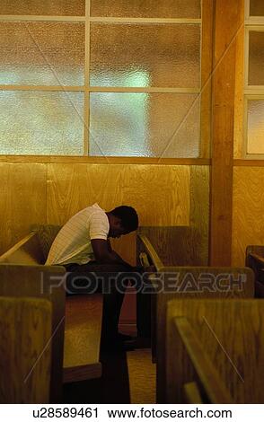 Stock Image - male, people, chapel, praying, black. Fotosearch