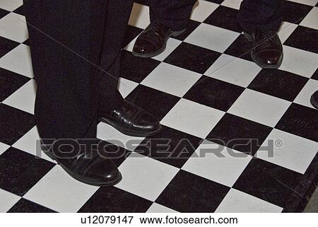 Stock Photo - men, floor, up, dressed, people, checkerd. Fotosearch