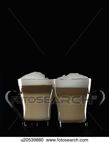 Stock Image - milk, cappacinos, froth, coffee, cappacino, two. Fotosearch