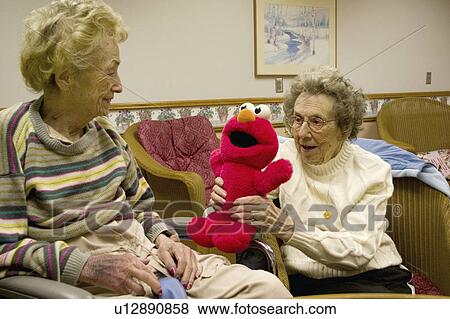 Stock Photo - minnesota, age, elmo, enjoying, 90, sisters. Fotosearch