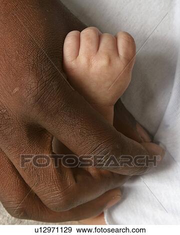 Stock Photo - moose, father, posed, kid, child, hands. Fotosearch