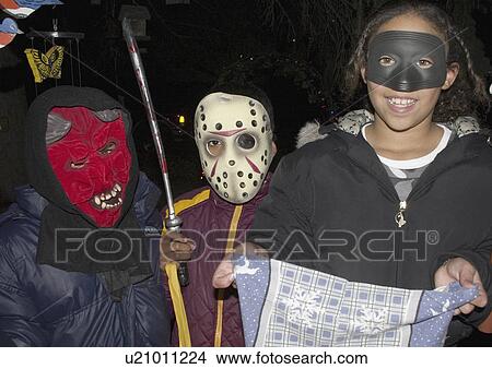 Picture - paul, trick, halloween, costumed, treaters, masked. Fotosearch
