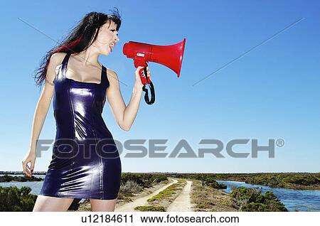 Stock Image - phone, woman, mega, yelling, female, beautiful. Fotosearch