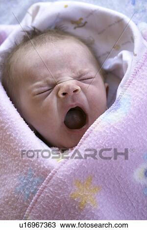 Stock Image - pink, released, yawning, girl, infant, model. Fotosearch