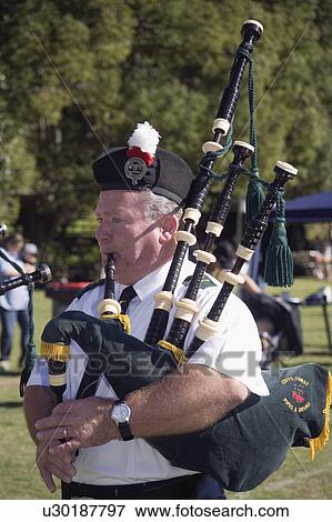Stock Photo - playing, traditional, wearing, bagpipes, male. Fotosearch