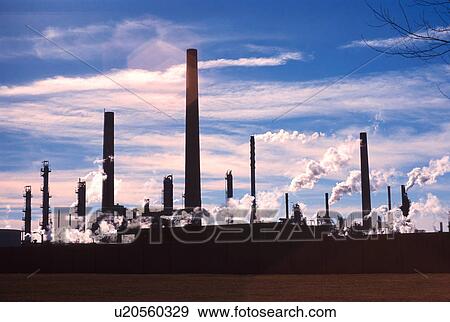 Stock Photo - pollution, refinery, smoke, smokestacks, backlit, oil. Fotosearch