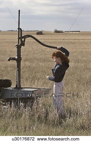 pump, girl, antique, get, tries, young View Large Photo Image Stock Image - pump, girl, antique, get, tries, young. Fotosearch