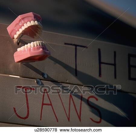 Stock Photo - reads, teeth, sign, makeshift, seen, false. Fotosearch