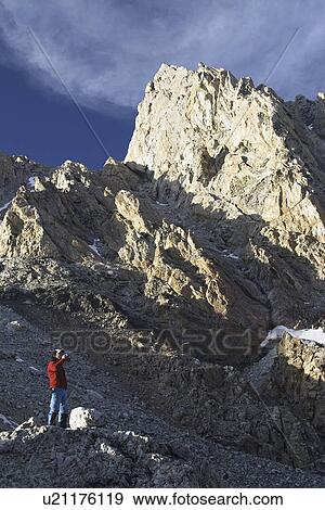 Stock Photo - released, boulder, sitting, male, model. Fotosearch