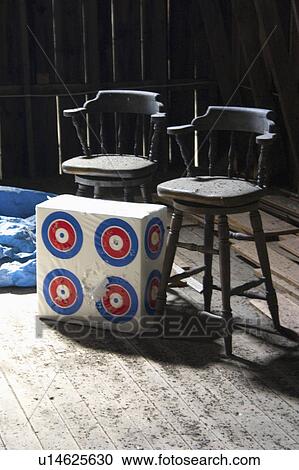 Stock Image - river, chairs, blue, barn, targets, bar. Fotosearch