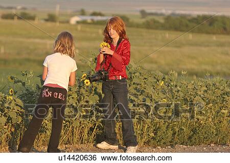 road, girls, country, wildflowers, picking, two View Large Photo Image Stock Photograph - road, girls, country, wildflowers, picking, two. Fotosearch