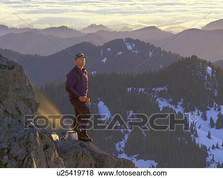 Stock Photo - rock, released, sunset, outdoors, mountain, model. Fotosearch