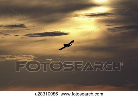 Stock Photograph - saskatchewan, duster, scenic, turn, making, crop. Fotosearch