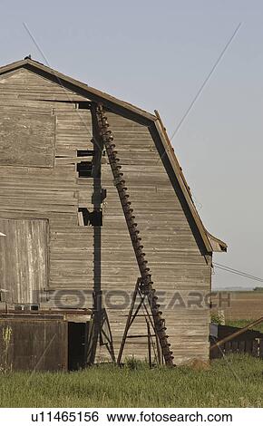 Stock Photograph - saskatchewan, rusted, scenic, barn, auger, old. Fotosearch