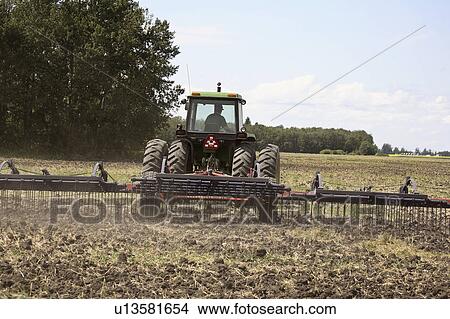 saskatchewan, spreading, scenic, field, manure, farmer View Large Photo Image Picture - saskatchewan, spreading, scenic, field, manure, farmer. Fotosearch