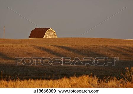 Stock Photo - scenic, barn, sunrise, up, lit, old. Fotosearch