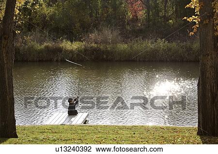 scenic, boy, dock, off, fishing, young View Large Photo Image Stock Image - scenic, boy, dock, off, fishing, young. Fotosearch