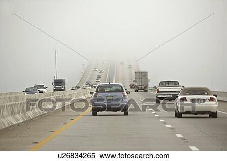 Stock Photography - scenic, fog, bridge, vehicles, hamper, morning. Fotosearch