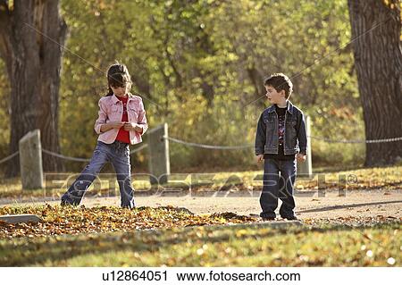 scenic, looking, leaves, autumn, down, siblings View Large Photo Image Stock Image - scenic, looking, leaves, autumn, down, siblings. Fotosearch