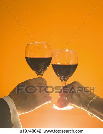 stemware, wine, hand, glass, red, toast View Large Photo Image Stock Image - stemware, wine, hand, glass, red, toast. Fotosearch