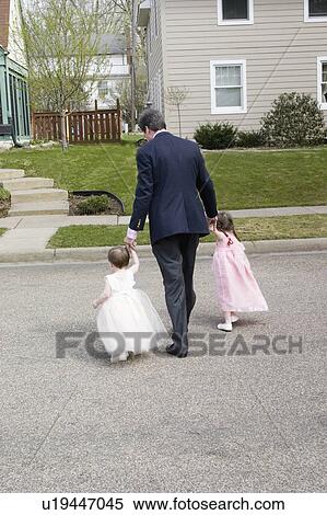street, walking, duds, easter, daughters, dad View Large Photo Image Stock Photography - street, walking, duds, easter, daughters, dad. Fotosearch