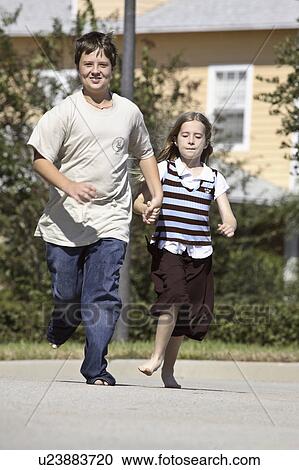 Stock Image - tampa, running, street, down, barefooted, siblings. Fotosearch