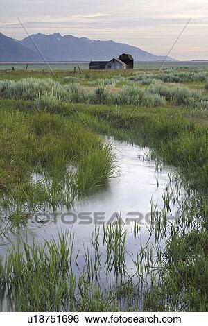Stock Photograph - teton, barns, grand, below, meadow, old. Fotosearch