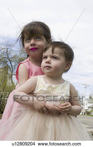 Picture - three, easter, one, age, dresses, sisters. Fotosearch