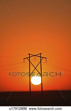 Stock Photo - tower, setting, hydro, saskatchewan, behind, sun. Fotosearch