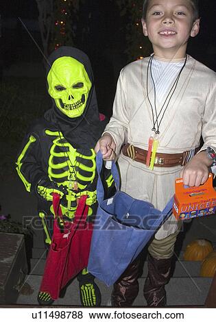 Stock Photo - treaters, explorer, trick, halloween, costumed, skeleton. Fotosearch