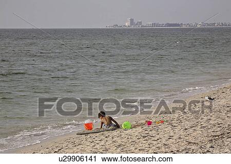 Stock Image - usa, boy, florida, beach, playing, young. Fotosearch