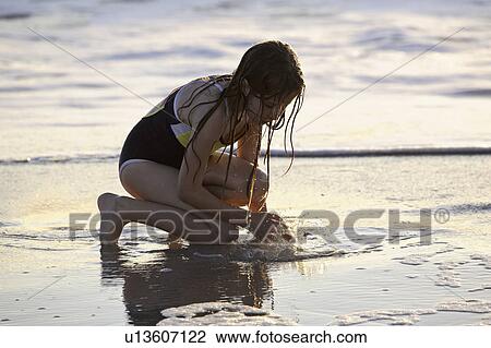 Stock Image - usa, girl, florida, beach, enjoying, young. Fotosearch