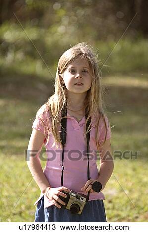 Stock Image - usa, girl, florida, scenic, camera, young. Fotosearch