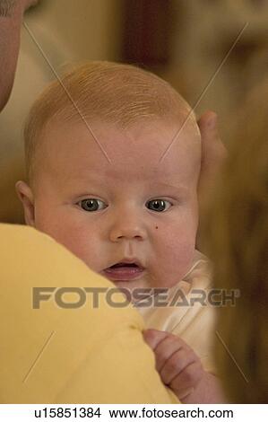 Picture - vining, holding, baptism, boy, baby, father. Fotosearch