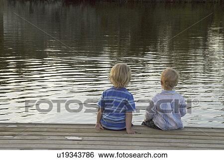 water, children, dock, sitting, kids, two View Large Photo Image Stock Photograph - water, children, dock, sitting, kids, two. Fotosearch
