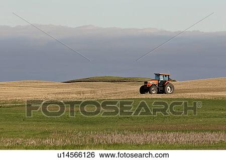 Stock Photograph - western, rest, saskatchewan, scenic, field, tractor. Fotosearch