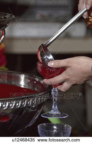 Stock Photography - wine, pouring, filling, bowl, punch, person. Fotosearch