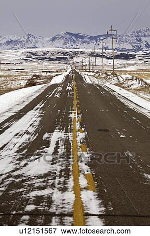Stock Photo - winter, highway, mountains, covered, snow, road. Fotosearch