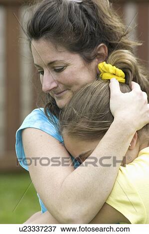 Stock Photo - 11, comforting, 39, age, daughter, mom. Fotosearch