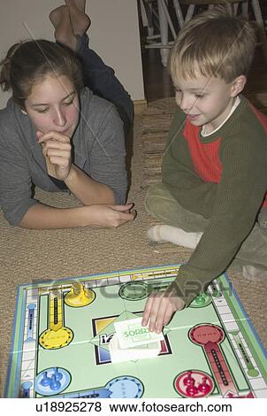 Stock Photo - age, board, playing, 14, cousins. Fotosearch