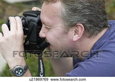 age, photographing, intently, 39, male View Large Photo Image Stock Photo - age, photographing, intently, 39, male. Fotosearch