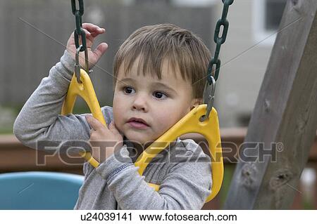Stock Image - age, rings, shoulder, swinging, boy. Fotosearch