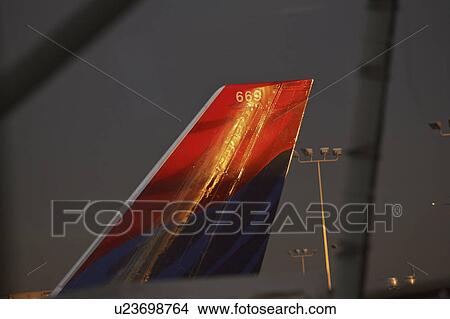 Picture - airport, sun, bay, tampa, tail, morning. Fotosearch