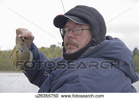 Stock Image - annual, proud, practices, catch, sunfish, fisherman. Fotosearch