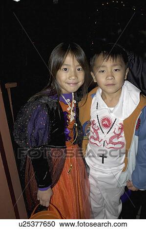 Stock Image - asian, age, treaters, trick, halloween. Fotosearch