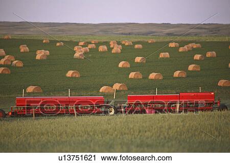 Stock Image - bales, seeding, hay, field, equipment, two. Fotosearch