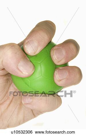Stock Photograph - ball, hand, stress, green, squeezing, mans. Fotosearch
