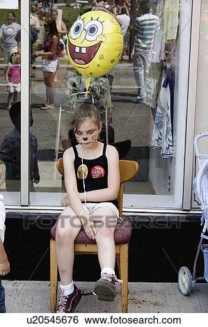 Stock Photograph - balloon, girl, sitting, 13, age, tired. Fotosearch