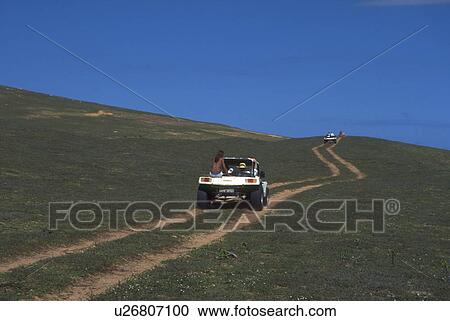 Stock Image - barren, buggies, road, rutted, follow, dune. Fotosearch