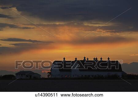 Stock Image - behind, sun, clouds, up, lighting, set. Fotosearch